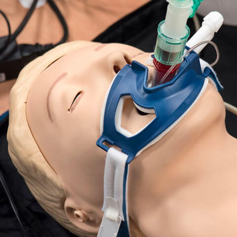 Dummy with breathing apparatus attached for trining purposes