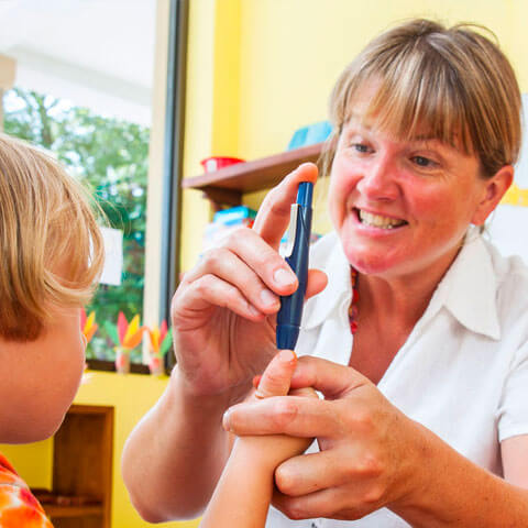 School worker checking a childs health