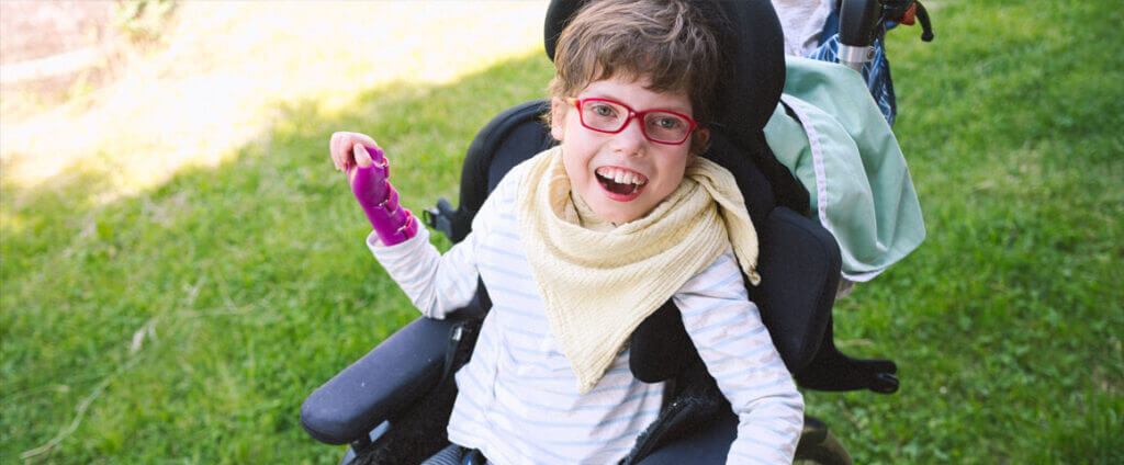 Girl smiling in a wheelchair